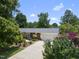 Charming brick home with a two-car garage, beautiful landscaping, and a spacious driveway at 401 Fletcher Dr, Raleigh, NC 27603