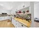 Stylish kitchen with stainless appliances, granite countertops, and ample cabinet storage at 401 Fletcher Dr, Raleigh, NC 27603