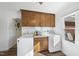 Functional laundry room featuring washer, dryer, and convenient overhead cabinetry at 401 Fletcher Dr, Raleigh, NC 27603
