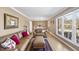 Cozy living room with hardwood floors, tan walls, and a large window letting in natural light at 401 Fletcher Dr, Raleigh, NC 27603