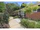 Quaint front patio featuring a cozy seating area, perfect for enjoying the serene surroundings near the brick home at 401 Fletcher Dr, Raleigh, NC 27603
