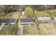 Aerial view of a well-maintained home with a spacious, green backyard and mature trees at 409 Avery St, Garner, NC 27529