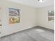 Bedroom featuring luxury vinyl flooring and two windows providing natural light at 409 Avery St, Garner, NC 27529