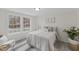 Brightly lit bedroom with neutral decor, large windows, and laminate flooring at 409 Avery St, Garner, NC 27529