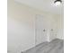 An empty room with clean, freshly painted walls and luxury hard wood floors at 409 Avery St, Garner, NC 27529