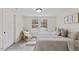 Bedroom featuring neutral color scheme, bright windows, and laminate flooring at 409 Avery St, Garner, NC 27529