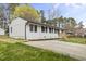Charming single-story home with a well-maintained lawn and a classic white brick facade at 409 Avery St, Garner, NC 27529