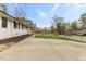 Charming single-story home with a well-maintained lawn and a classic white brick facade at 409 Avery St, Garner, NC 27529