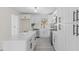 Well-lit kitchen with white cabinetry, modern hardware, stainless steel appliances, and ample counter space at 409 Avery St, Garner, NC 27529
