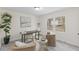 Bright office with large windows, neutral decor, modern desk and chairs, creating a stylish workspace at 409 Avery St, Garner, NC 27529