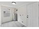 Utility room with new water heater, laminate flooring, and fresh paint at 409 Avery St, Garner, NC 27529