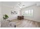 Comfortable living room with large windows and a ceiling fan at 5300 Mandrake Ct, Raleigh, NC 27613