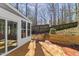 Charming backyard patio area with brick accents and wooden stairs at 6008 Chittim Ct, Raleigh, NC 27616