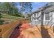 Charming backyard patio area with brick accents and wooden stairs at 6008 Chittim Ct, Raleigh, NC 27616