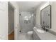 Modern bathroom with glass shower, granite countertop, and sleek fixtures at 6008 Chittim Ct, Raleigh, NC 27616