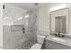 Modern bathroom with a glass shower, granite countertop sink, and light fixtures at 6008 Chittim Ct, Raleigh, NC 27616