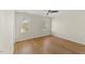 Spacious bedroom with hardwood floors, ceiling fan and double windows at 6008 Chittim Ct, Raleigh, NC 27616