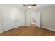 Bedroom with hardwood floors, ceiling fan, double closets and attached bathroom at 6008 Chittim Ct, Raleigh, NC 27616