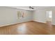 Spacious bedroom with gleaming hardwood floors, a ceiling fan, and plenty of natural light at 6008 Chittim Ct, Raleigh, NC 27616
