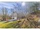 Two-story home with a two-car garage and lush green lawn in a natural setting at 6008 Chittim Ct, Raleigh, NC 27616