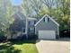 Charming two-story home with an attached two-car garage and a well-manicured lawn at 6008 Chittim Ct, Raleigh, NC 27616