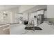 A contemporary kitchen with stainless steel appliances, white cabinets, and granite countertops on the spacious island at 6008 Chittim Ct, Raleigh, NC 27616