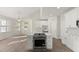 Bright kitchen with white cabinets, stainless steel appliances and a large island with bar seating area at 6008 Chittim Ct, Raleigh, NC 27616