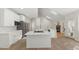 Spacious kitchen with island, quartz countertop, stainless steel appliances, and open concept to living space at 6008 Chittim Ct, Raleigh, NC 27616