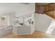 Bright kitchen with white cabinets, stainless steel appliances, and a spacious island with granite countertops at 6008 Chittim Ct, Raleigh, NC 27616