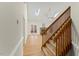 View of the light-filled living room with hardwood floors and staircase at 6008 Chittim Ct, Raleigh, NC 27616