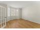Cozy and bright living room featuring hardwood floors and large windows at 6008 Chittim Ct, Raleigh, NC 27616