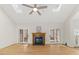 Open living room features a fireplace, hardwood floors, and plenty of natural light at 6008 Chittim Ct, Raleigh, NC 27616