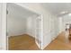 Bright living space with hardwood floors, natural light and a convenient doorway at 6008 Chittim Ct, Raleigh, NC 27616