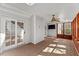 Bright sunroom with hardwood floors, ceiling fan and sliding doors to outdoor space at 6008 Chittim Ct, Raleigh, NC 27616