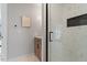 Modern bathroom featuring a glass shower and wood vanity at 609 Brookview Dr, Chapel Hill, NC 27514
