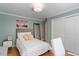 Bedroom featuring a comfortable bed, closet with sliding doors and ample storage, and natural light at 609 Brookview Dr, Chapel Hill, NC 27514
