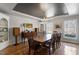 Charming dining room featuring hardwood floors and a black tray ceiling at 609 Brookview Dr, Chapel Hill, NC 27514