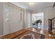 Elegant foyer featuring hardwood floors, a grand doorway, and a view of a living area with a piano at 609 Brookview Dr, Chapel Hill, NC 27514