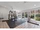 Bright and spacious gym equipped with various exercise machines, natural light, and a backyard view at 609 Brookview Dr, Chapel Hill, NC 27514
