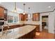 Well-equipped kitchen with granite countertops, island, and stainless steel appliances at 609 Brookview Dr, Chapel Hill, NC 27514
