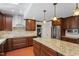 Spacious kitchen boasting granite countertops, island, and stainless steel appliances at 609 Brookview Dr, Chapel Hill, NC 27514
