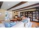 Spacious living room with built-in bookcase and large windows at 609 Brookview Dr, Chapel Hill, NC 27514
