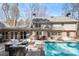 Inviting backyard with a refreshing pool and patio area, perfect for outdoor entertaining and relaxation at 609 Brookview Dr, Chapel Hill, NC 27514