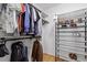 Walk-in closet featuring multiple storage areas for clothing and shoes at 609 Brookview Dr, Chapel Hill, NC 27514