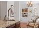 Wet bar with granite countertops, wine rack, and access to a sun room at 609 Brookview Dr, Chapel Hill, NC 27514