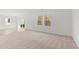 Bright and airy living area with a sliding glass door leading to the backyard at 73 Club Rd, Louisburg, NC 27549