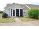 Exterior view of home featuring a screened-in porch and well-maintained yard at 75 E Moss Creek Dr, Clayton, NC 27520