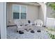 Backyard patio area with two chairs and a small table for outdoor relaxation at 75 E Moss Creek Dr, Clayton, NC 27520