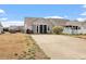 Backyard view with patio, fenced yard, and well-maintained lawn at 75 E Moss Creek Dr, Clayton, NC 27520