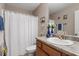 Bathroom with a white shower curtain and matching decor around the countertop at 75 E Moss Creek Dr, Clayton, NC 27520
